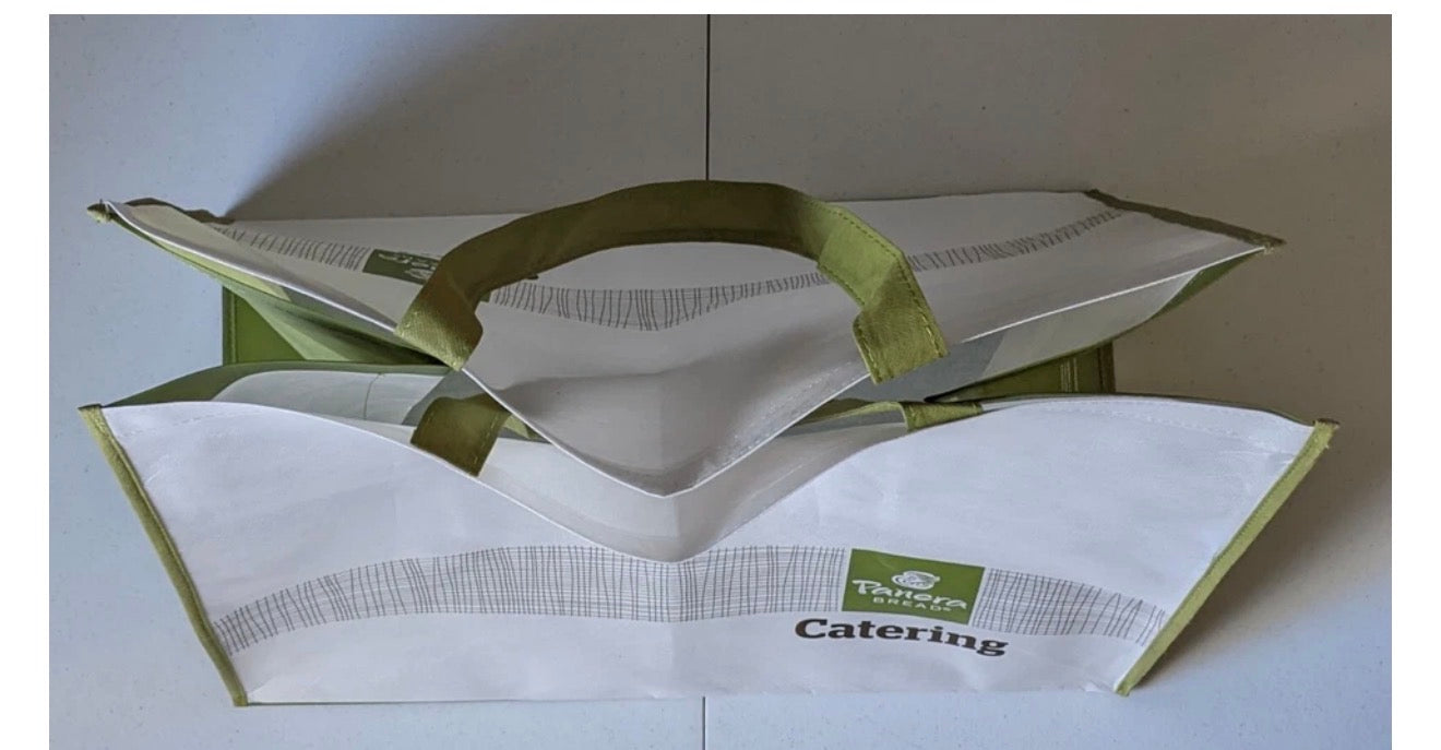 Large reusable grocery tote by Beauty and Wound, featuring Panera Bread Catering branding, measuring 21x12x18 inches.
